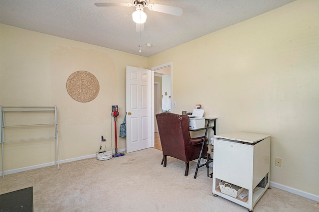 office with light carpet, a textured ceiling, and ceiling fan