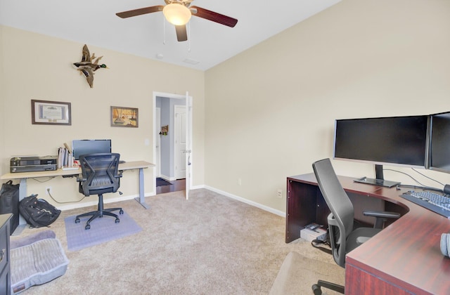 office area with baseboards, carpet, and a ceiling fan