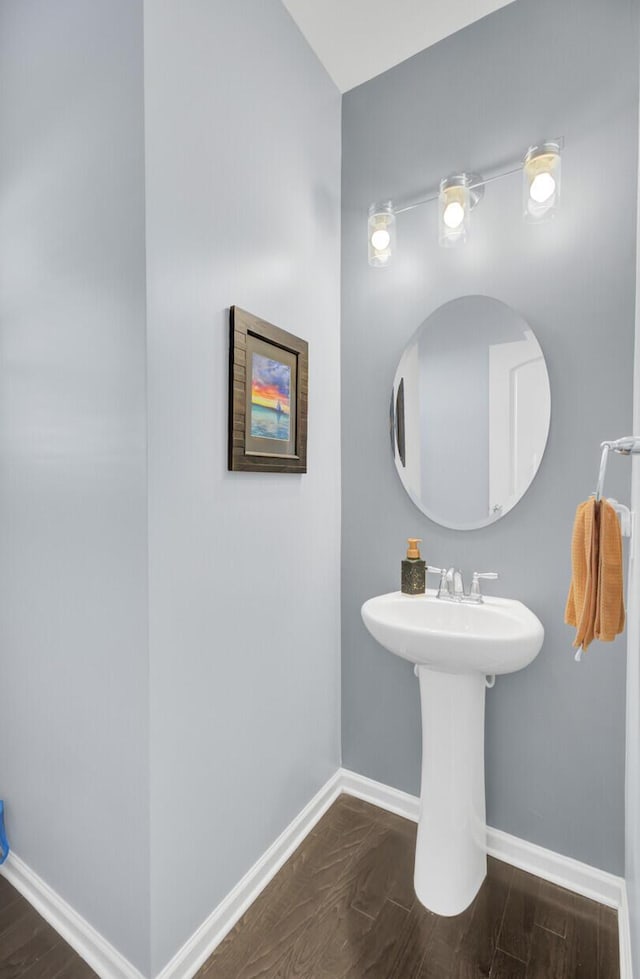 bathroom featuring baseboards and wood finished floors