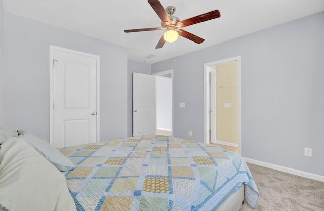 carpeted bedroom featuring baseboards and ceiling fan