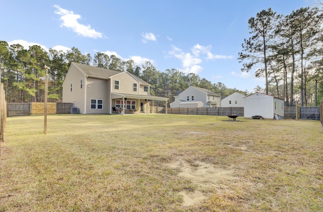 view of yard featuring central AC unit and a fenced backyard