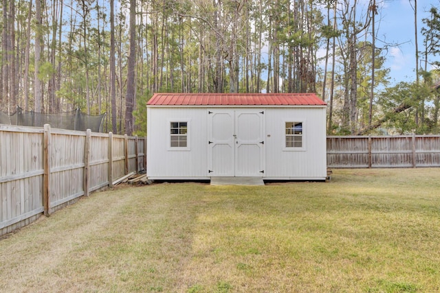 view of shed with a fenced backyard