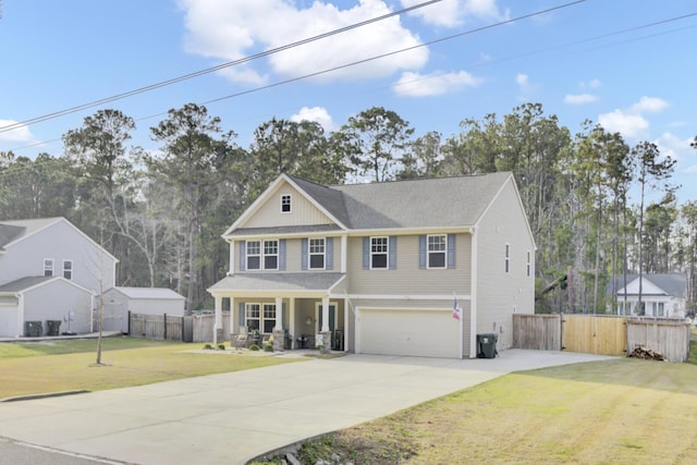 traditional-style home featuring fence, a porch, concrete driveway, a front yard, and a garage