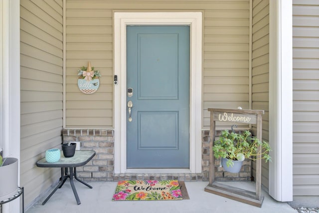 entrance to property with stone siding