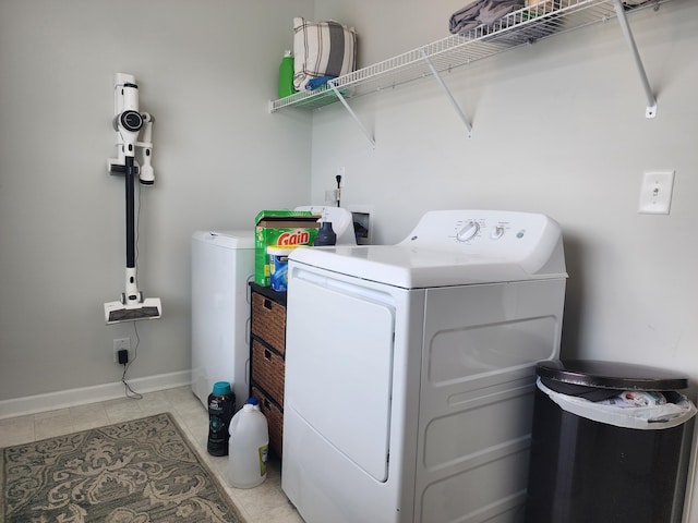 435 Foxbank Plantation Blvd, Moncks Corner, SC 29461 - clothes washing area with washing machine and clothes dryer, light tile patterned floors, laundry area, and baseboards