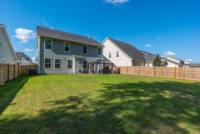 435 Foxbank Plantation Blvd, Moncks Corner, SC 29461 - rear view of house featuring a fenced backyard, central AC unit, a gazebo, and a yard