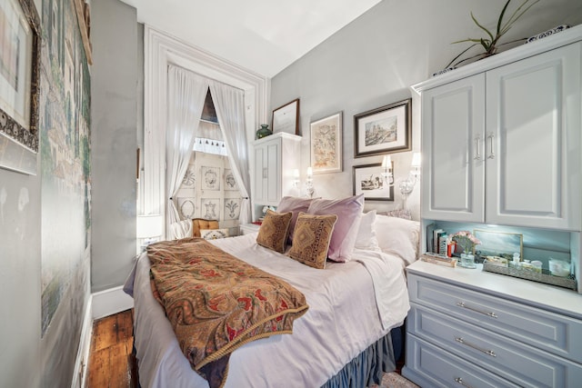 bedroom featuring dark wood-type flooring