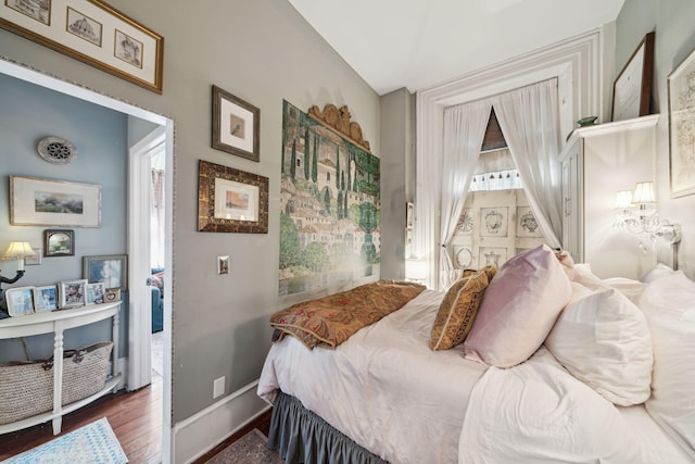 bedroom featuring dark hardwood / wood-style flooring