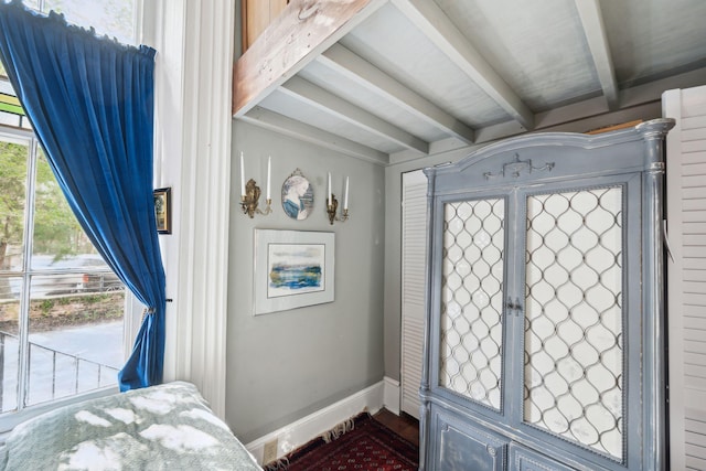 foyer with beamed ceiling