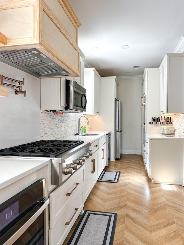 10 Riker St, Charleston, SC 29403 - kitchen featuring stainless steel appliances, custom exhaust hood, tasteful backsplash, white cabinets, and crown molding