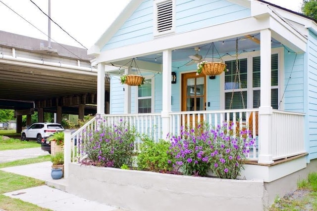 10 Riker St, Charleston, SC 29403 - doorway to property featuring a porch and a carport