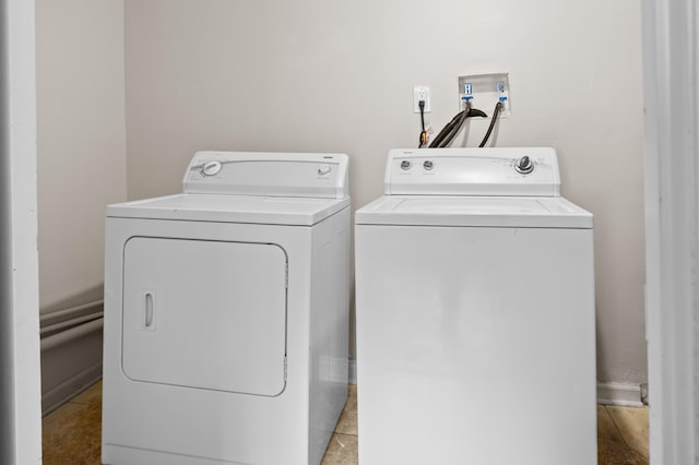 clothes washing area with washer and dryer