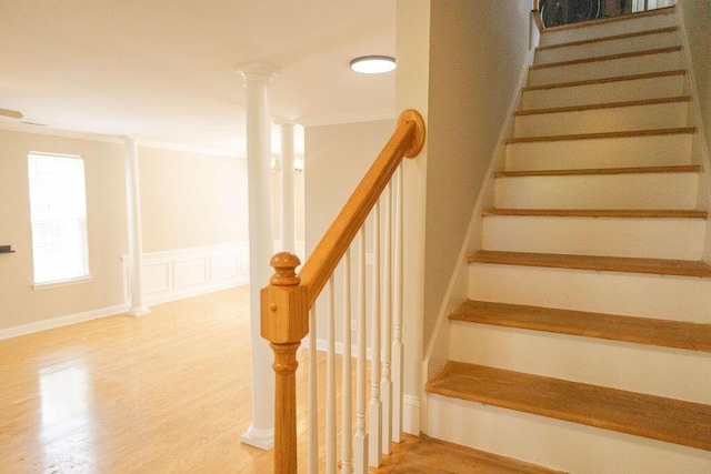 stairs featuring wood finished floors