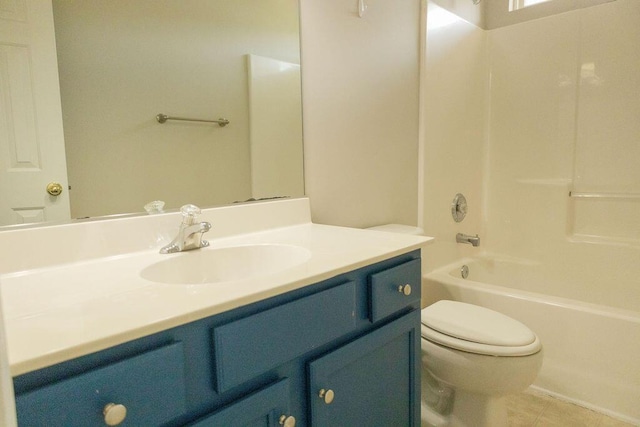 bathroom with toilet, tile patterned floors,  shower combination, and vanity