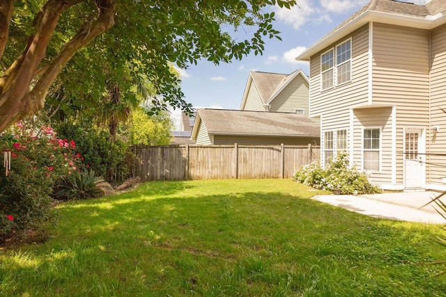 view of yard featuring fence and a patio area