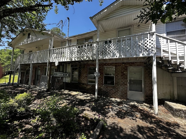 927 N Lemacks St, Walterboro, SC 29488 - rear view of house featuring stairway, a deck, and brick siding