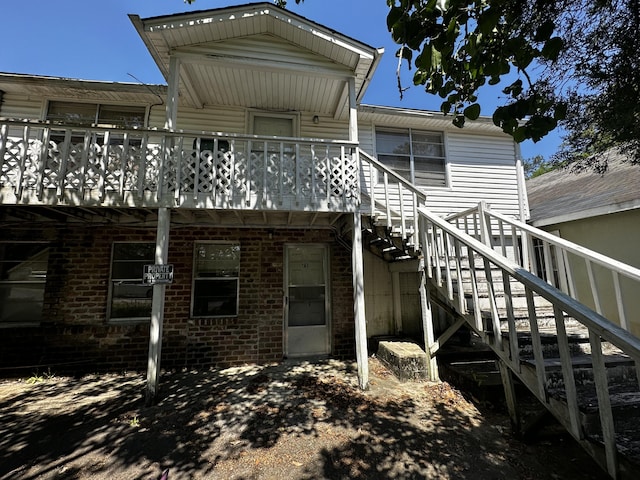 927 N Lemacks St, Walterboro, SC 29488 - rear view of house with stairs, brick siding, and a wooden deck