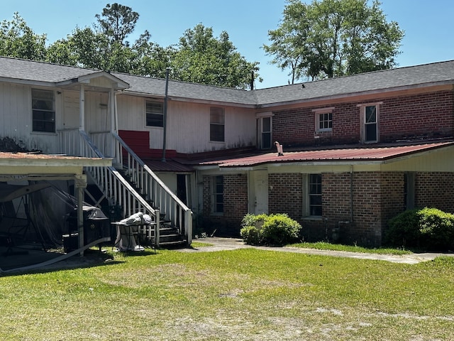 927 N Lemacks St, Walterboro, SC 29488 - back of house with a lawn and brick siding