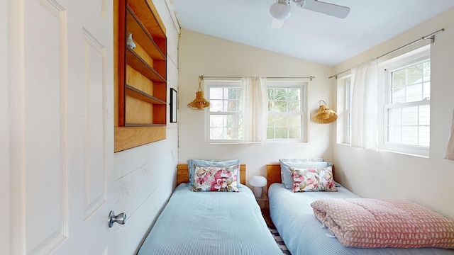 bedroom featuring ceiling fan and lofted ceiling