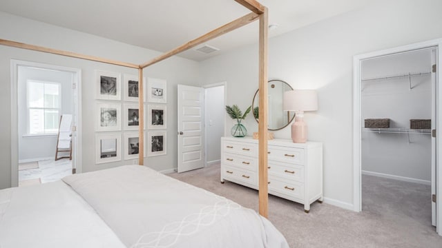 304 Archar St, Summerville, SC 29486 - bedroom featuring a walk in closet, light colored carpet, a closet, and ensuite bath