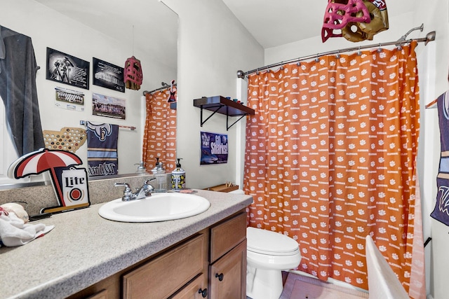 full bathroom with shower / bath combo with shower curtain, tile patterned flooring, toilet, and vanity