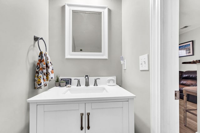 bathroom featuring vanity and wood-type flooring