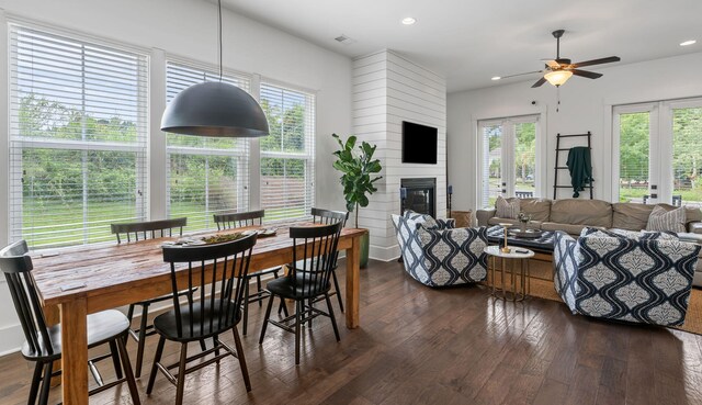 dining room featuring ceiling fan, dark hardwood / wood-style floors, and french doors