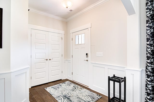 entryway with crown molding and dark wood-type flooring