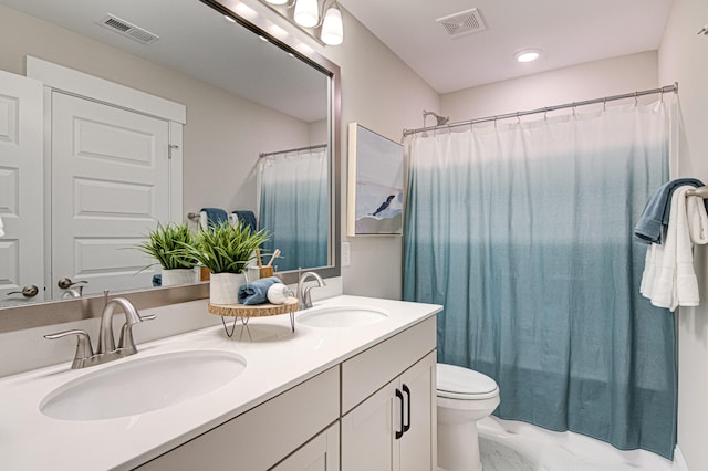 full bathroom with vanity, shower / bath combination with curtain, and toilet