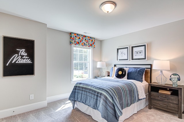 bedroom with light carpet