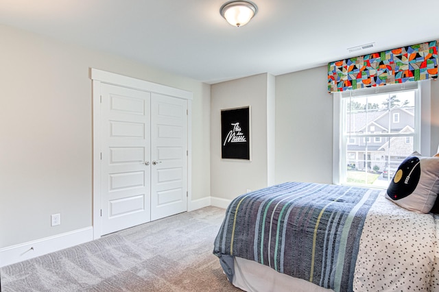 carpeted bedroom featuring a closet