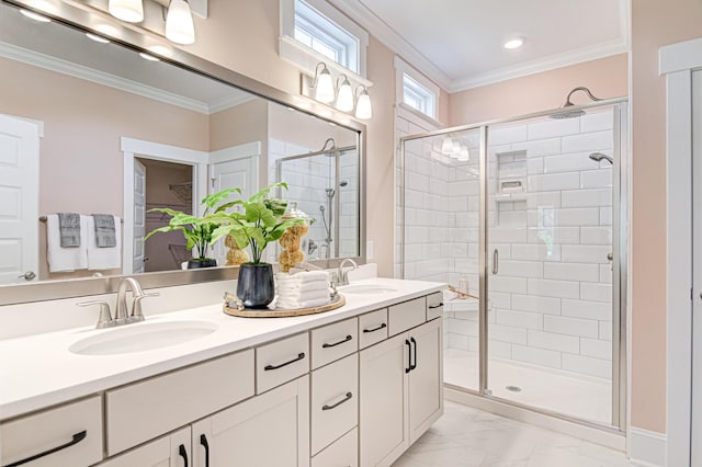 bathroom featuring vanity, a shower with shower door, and ornamental molding