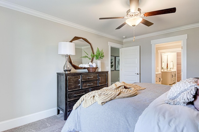 carpeted bedroom with connected bathroom, ceiling fan, and ornamental molding