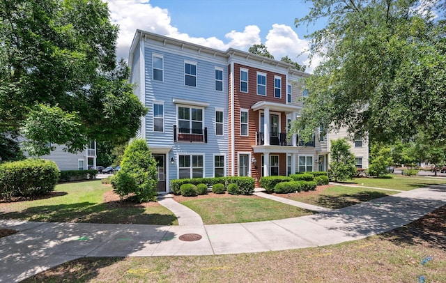 view of property featuring a front yard