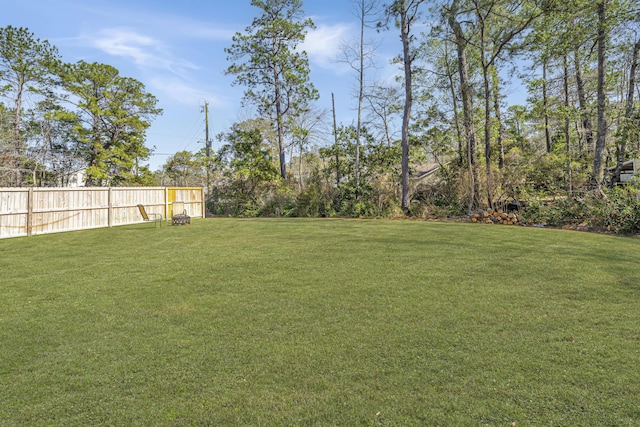 view of yard featuring fence