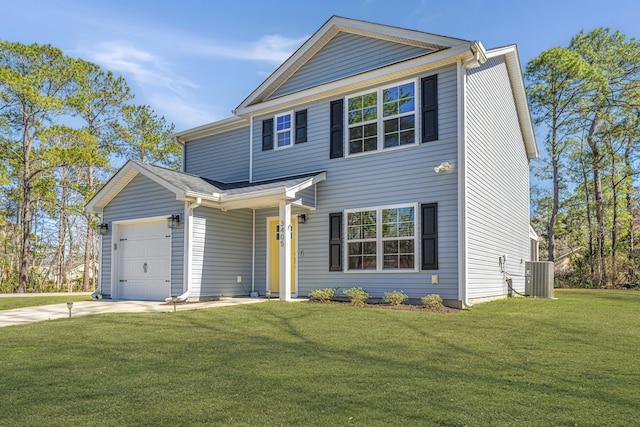 traditional-style home with driveway, a front yard, and an attached garage