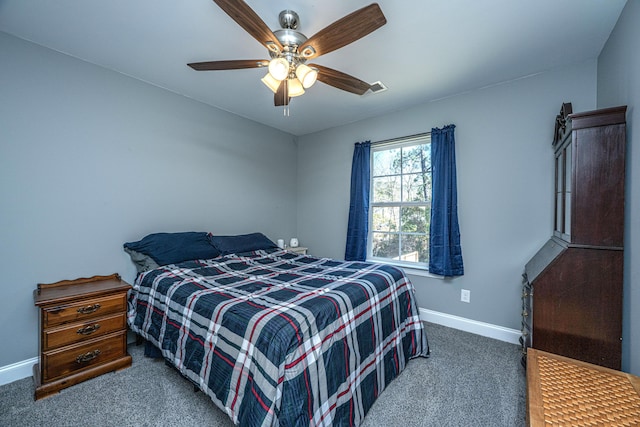 bedroom featuring a ceiling fan, carpet, and baseboards