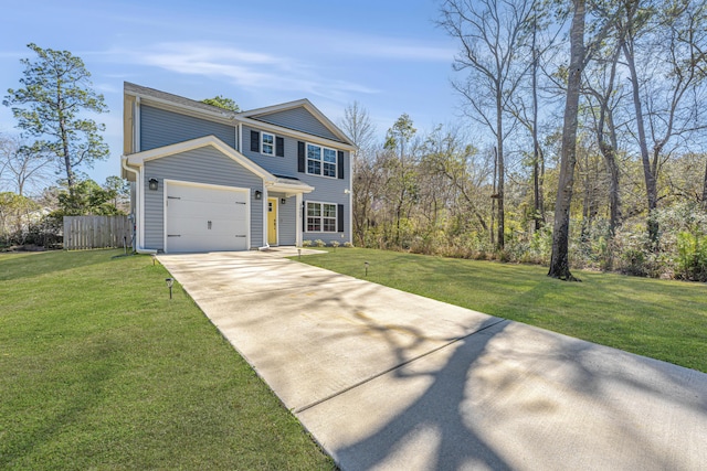 view of front of home featuring driveway, a front yard, a garage, and fence