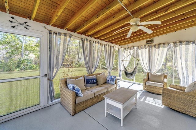 sunroom / solarium with beam ceiling, wood ceiling, and a ceiling fan