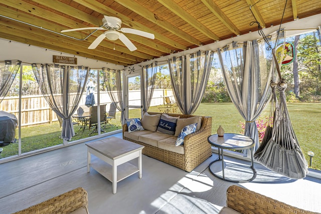 sunroom / solarium with wood ceiling and ceiling fan