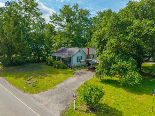 145 Ravenell Dr, Saint Stephen, SC 29479 - view of front facade featuring a front yard and asphalt driveway