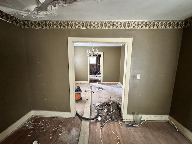 unfurnished dining area featuring a notable chandelier