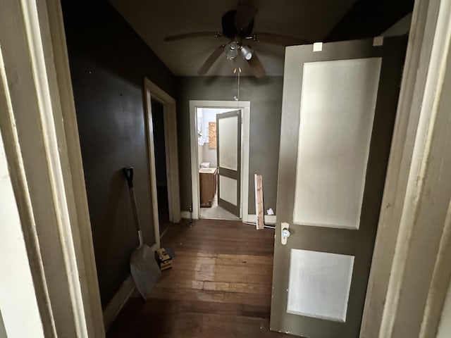 hallway with dark wood-type flooring