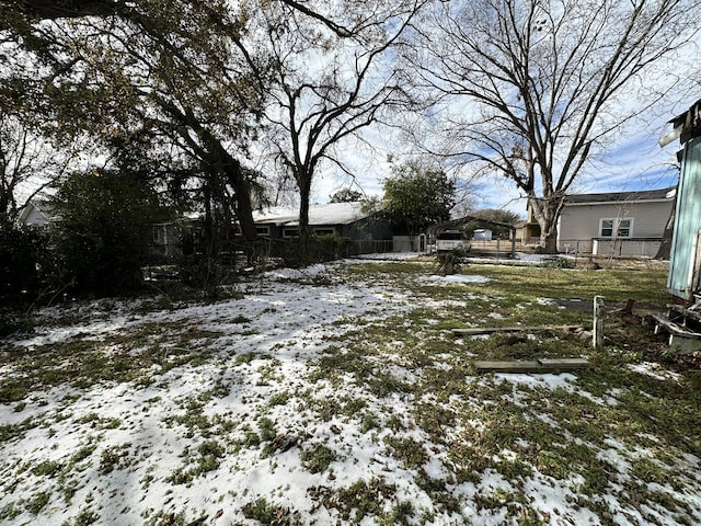 view of yard layered in snow