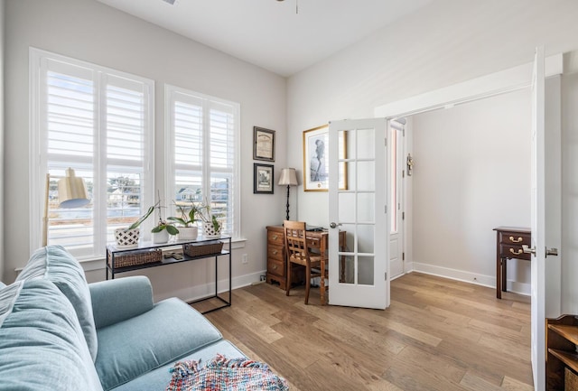 office featuring french doors and light hardwood / wood-style flooring