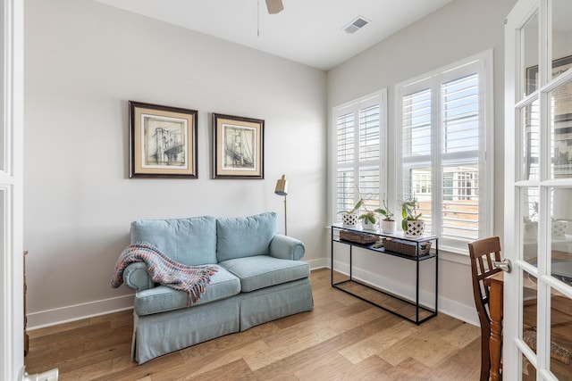 interior space with light hardwood / wood-style floors, ceiling fan, and a healthy amount of sunlight