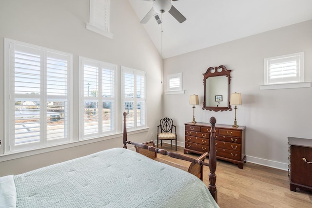 bedroom featuring ceiling fan, light hardwood / wood-style floors, and high vaulted ceiling