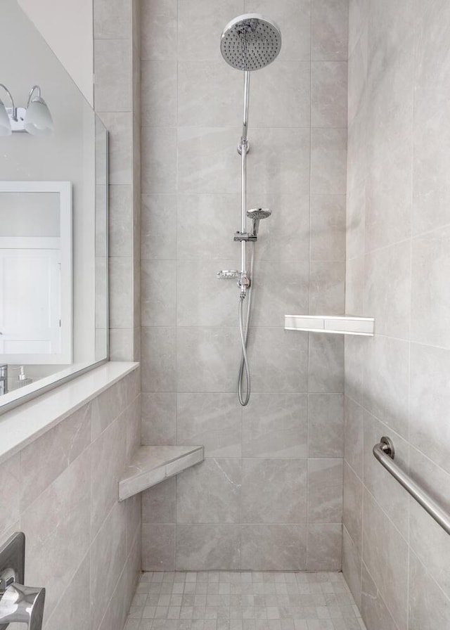 bathroom with a tile shower