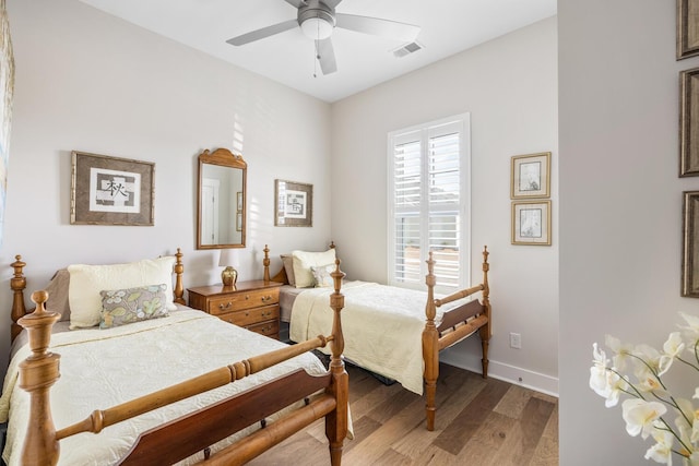 bedroom featuring ceiling fan and light hardwood / wood-style floors