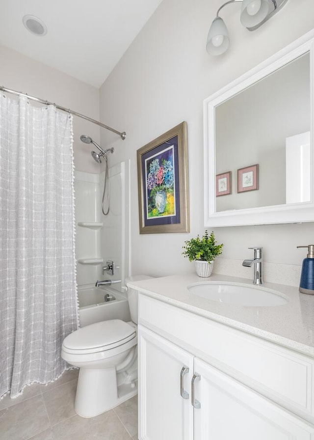 full bathroom featuring toilet, vanity, tile patterned flooring, and shower / bath combo